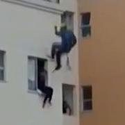 Suicide Jumper Kicked Back In Window By Rescue Commando